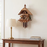 Hermle Wood Sawyers Musical Chalet 1-Day Cuckoo Clock, 6258T - shown hanging on a wall
