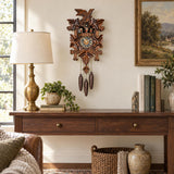 Hermle Leaf & Bird Musical 1-Day Cuckoo Clock, 600/3T - shown hanging on a wall