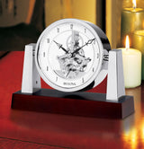 Bulova B7520 Largo skeleton mantel clock on a table by candlelight