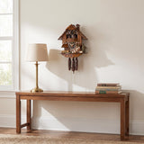 Hermle Woodcutter Musical Chalet 1-Day Cuckoo Clock, 678T - shown hanging on a wall